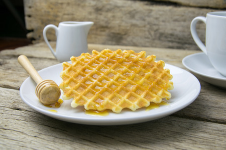 waffle with a cup of Coffee and honeyの写真素材