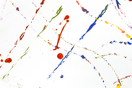 Colored paint splash, isolated on white backgroundの写真素材