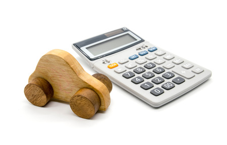 Calculator and car wood on white backgroundの写真素材