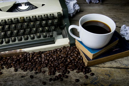 typewriter and coffee on wood backgroundの写真素材