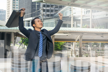 businessman holding a briefcase, powerful businessmanの写真素材