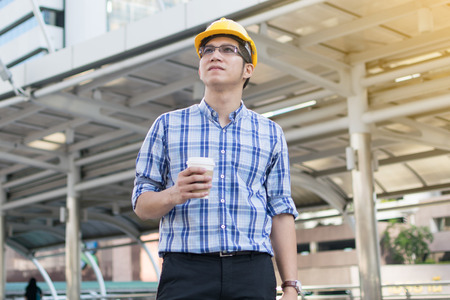 Foreman construction worker holding blueprintの写真素材