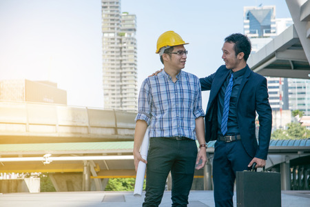 businessman worker handshaking on construction siteの写真素材
