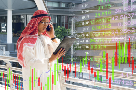 Arab businessman check graph on smartphone, finance concept