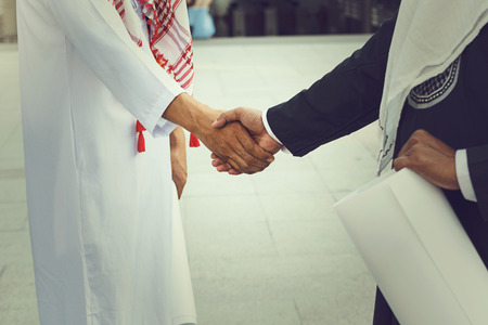 Arab businessmen worker handshaking on construction site