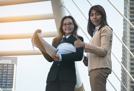 Two businesswomen worker handshaking on construction siteの写真素材