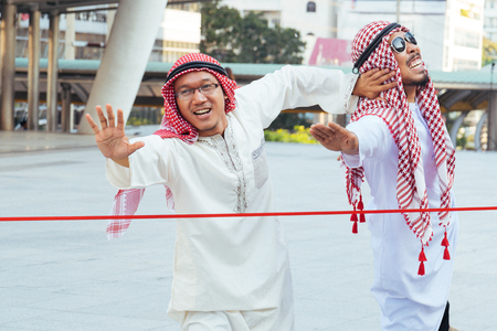 The arab man is running to go to the finish lineの写真素材