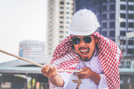 Arab businessman Pull the ropeの写真素材