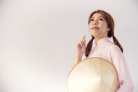 Beautiful woman in pink Vietnam Traditional dress of Dress culture Vietnameseの写真素材