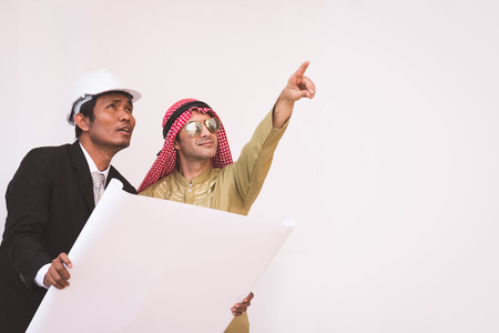 Arab architects and foreman are planning new projectの写真素材