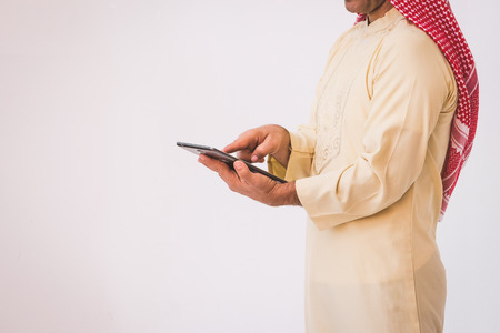 Arab businessman useing on a mobile phoneの写真素材