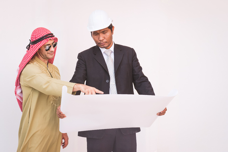 Arab architects and foreman are planning new projectの写真素材