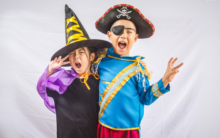 Happy brother and sisters on Halloweenの写真素材