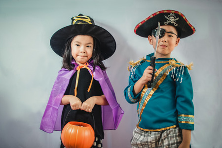 Happy brother and sisters on Halloweenの写真素材