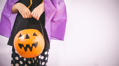 Beautiful girl witch with pumpkinの写真素材