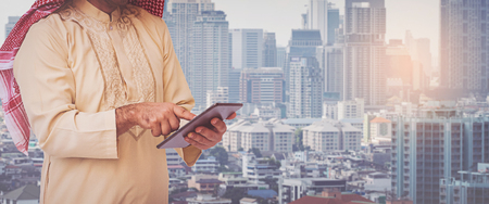 Arab businessman useing on a mobile phoneの写真素材