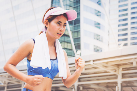 Woman is exercising in the cityの写真素材