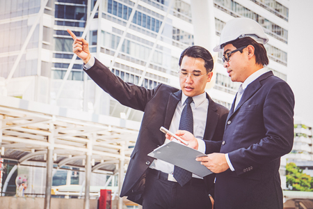 Businessmen planning construction projectの写真素材