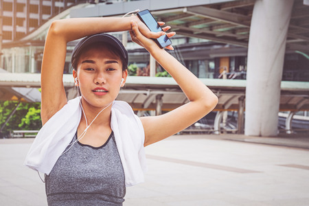 Woman is exercising in the cityの写真素材