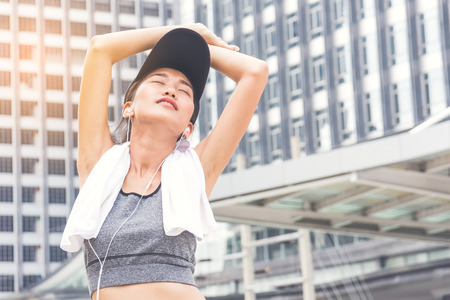 Woman is exercising in the city