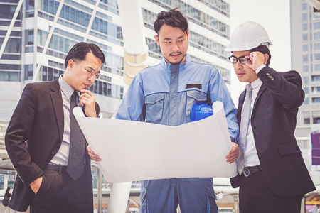 business manager and engineer meeting project at construction siteの写真素材