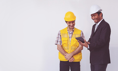 Construction manager and engineer talking