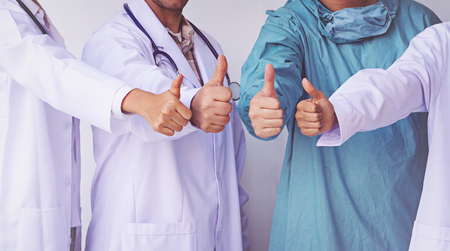 Doctors and Nurses coordinate hands.doctors thumb up, Concept Teamworkの写真素材