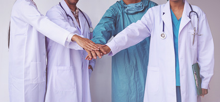 Doctors and Nurses coordinate hands. Concept Teamworkの写真素材