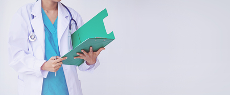 Doctor holding a clipboard with prescriptionの写真素材