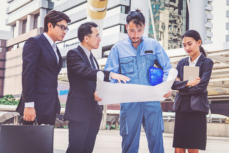 business manager and engineer meeting project at construction siteの写真素材
