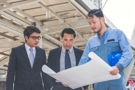 business manager and engineer meeting project at construction siteの写真素材