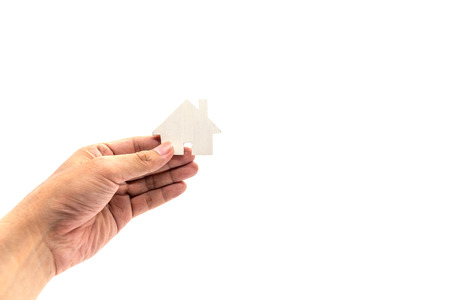 hand holding white house icon concept. on white blackgroundの写真素材