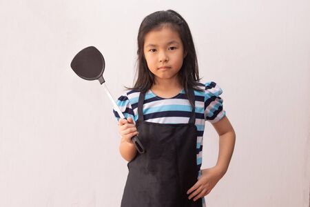 Asia girl hand holding a spatulaの写真素材