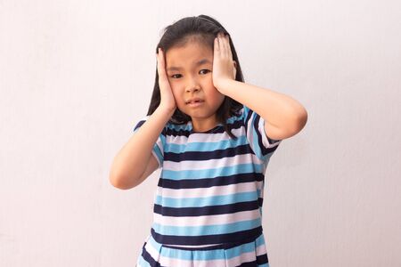 Asian girl feeling the strain.