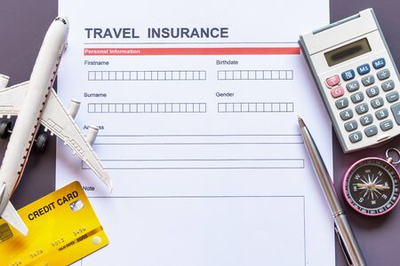 Travel  insurance form with model and policy documentの写真素材