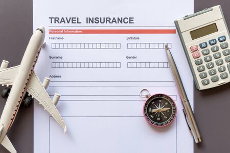 Travel  insurance form with model and policy documentの写真素材