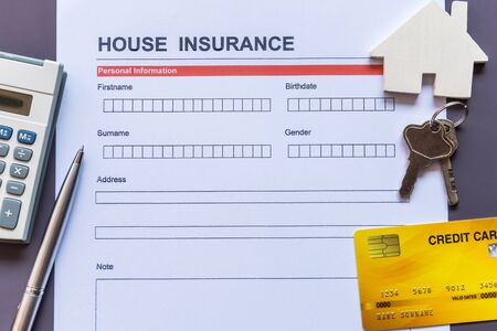 House insurance form with model and policy documentの写真素材