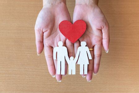 woman hands holding red heart and icon family, health care, family insurance concept