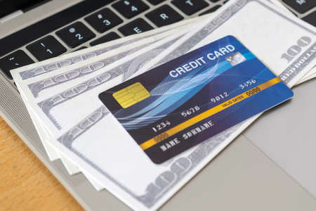 Credit card and money on a computer keyboard. shopping online concept, Online paymentの写真素材