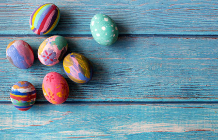 Colorful Easter eggs on table. Easter festive holidays concept.の写真素材