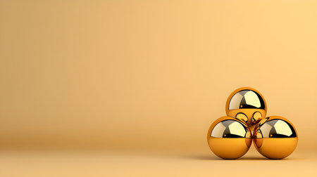 A three shiny golden spheres with reflections are arranged in minimalist style against smooth, warm beige background, creating sense of elegance and simplicityの素材