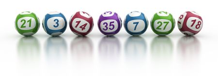 3d rendering of lottery balls on a white reflective tableの写真素材