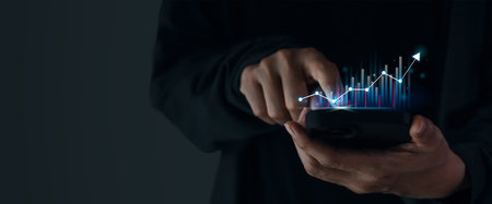 Growing virtual hologram stock showing on smartphone in businessman or trader -Stock market planning...