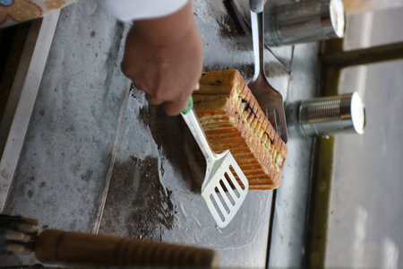 Chef is cooking bread in the kitchen of a restaurant, Thailand.の写真素材