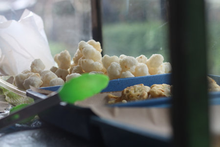 Crispy rice cracker in plastic box on the table.の写真素材