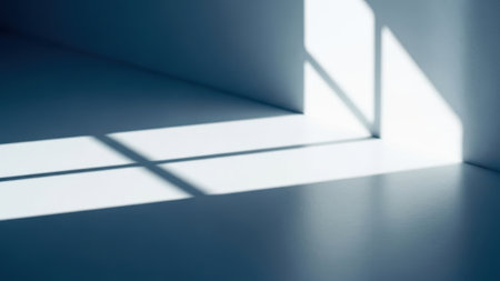 The image depicts a minimalist room with sunlight streaming in through a window, casting distinct shadows on the floor. The room has a clean, modern aesthetic with white walls and a transparent background.の素材