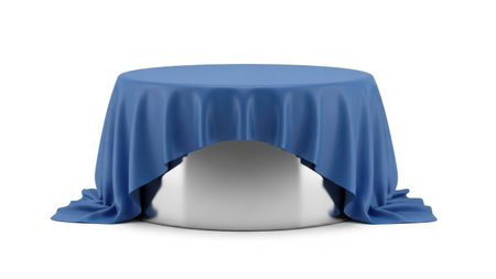 A round table draped with a blue tablecloth, featuring a white base, set against a plain background.の素材