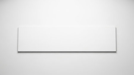 A simple, white shelf is mounted on a plain, white wall, creating a minimalist aesthetic.の素材