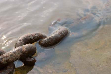 rusty chain in waterの写真素材