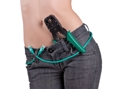 beautiful young girl with a network cable and crimping closeup
